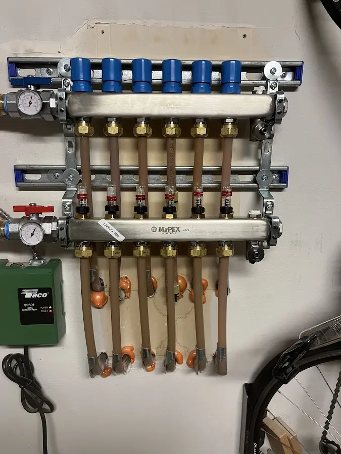 Plumber performing Water Heater Repair at a residential property in Lake Jackson